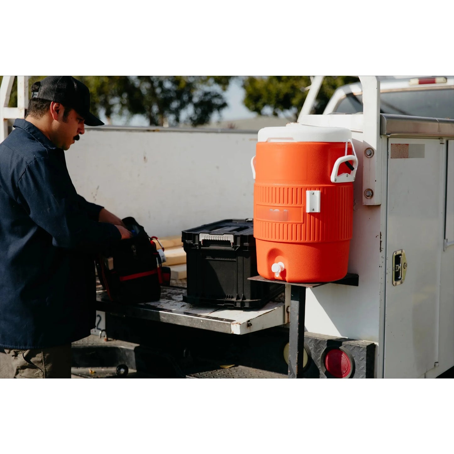 Heavy Duty Beverage Cooler Featuring Durable Plastic And Steel Trim